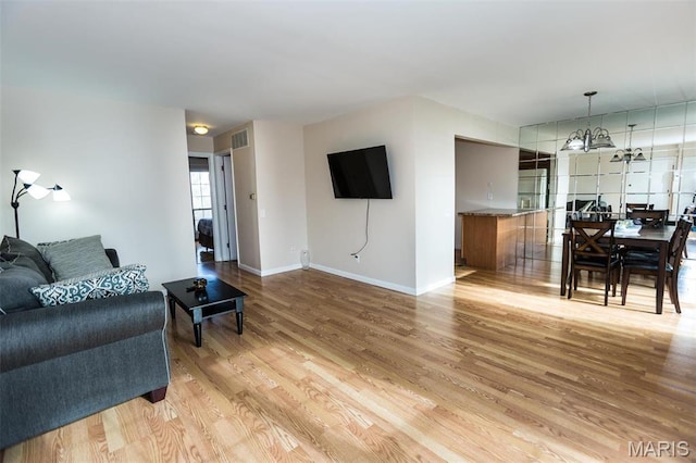1167 Appleseed Ln Unit D, Olivette, MO 63132 - living area featuring light wood-type flooring and baseboards