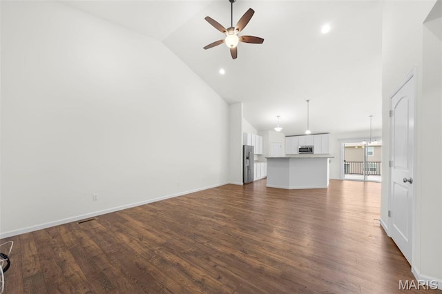 5341 Trailhead Ct, Eureka, MO 63025 - unfurnished living room with ceiling fan, high vaulted ceiling, dark wood-type flooring, baseboards, and recessed lighting