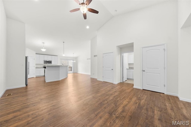 5341 Trailhead Ct, Eureka, MO 63025 - unfurnished living room with a ceiling fan, high vaulted ceiling, wood finished floors, and baseboards