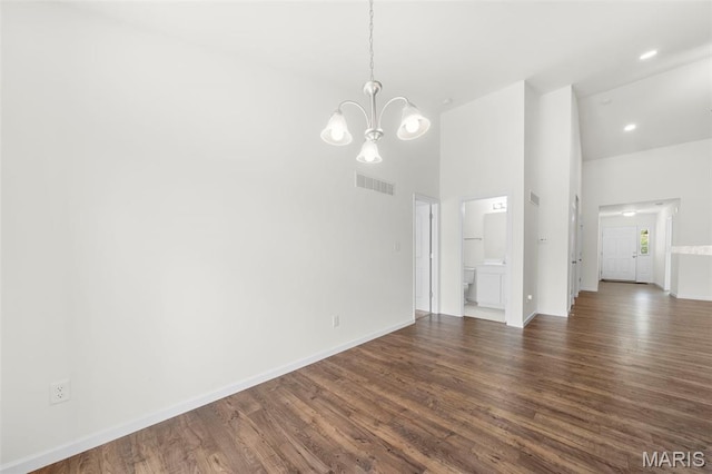 5341 Trailhead Ct, Eureka, MO 63025 - unfurnished dining area featuring a chandelier, dark wood finished floors, high vaulted ceiling, baseboards, and recessed lighting