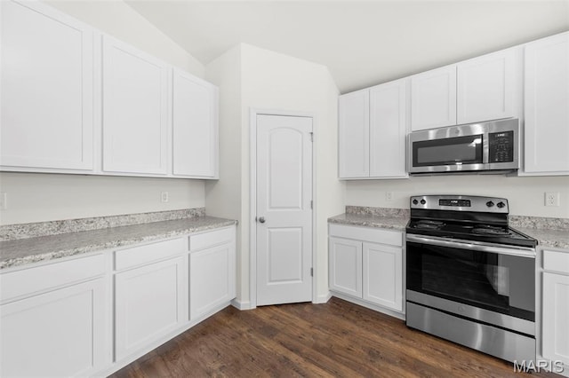 5341 Trailhead Ct, Eureka, MO 63025 - kitchen with stainless steel appliances, dark wood-style floors, white cabinets, and light countertops