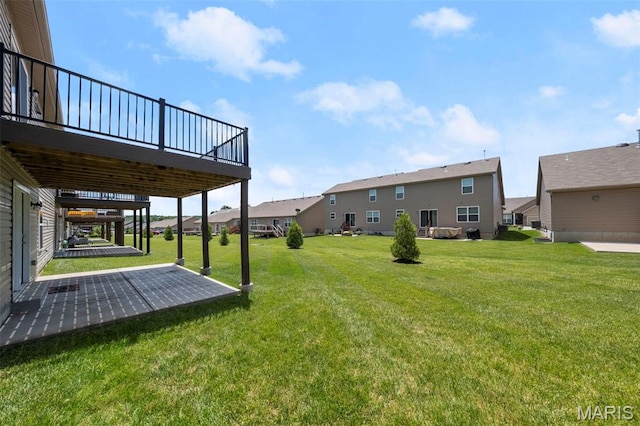 5341 Trailhead Ct, Eureka, MO 63025 - view of grassy yard featuring a patio, a deck, and a residential view