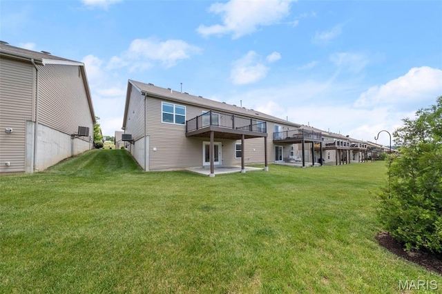 5341 Trailhead Ct, Eureka, MO 63025 - back of property featuring a patio area, a yard, and a wooden deck