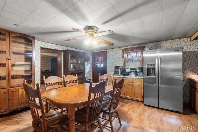 1821 Pcr 916, Perryville, MO 63775 - dining space with wallpapered walls, a ceiling fan, and light wood-style floors