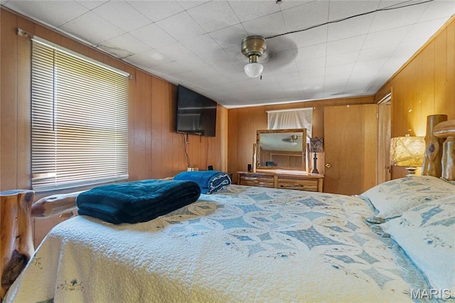 1821 Pcr 916, Perryville, MO 63775 - bedroom with wood walls and ceiling fan