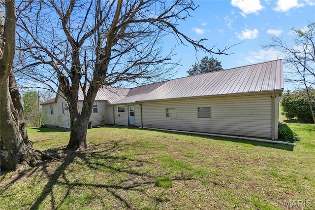 1821 Pcr 916, Perryville, MO 63775 - back of house with metal roof and a lawn