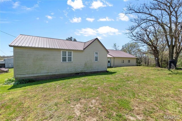 1821 Pcr 916, Perryville, MO 63775 - view of side of home featuring metal roof and a yard