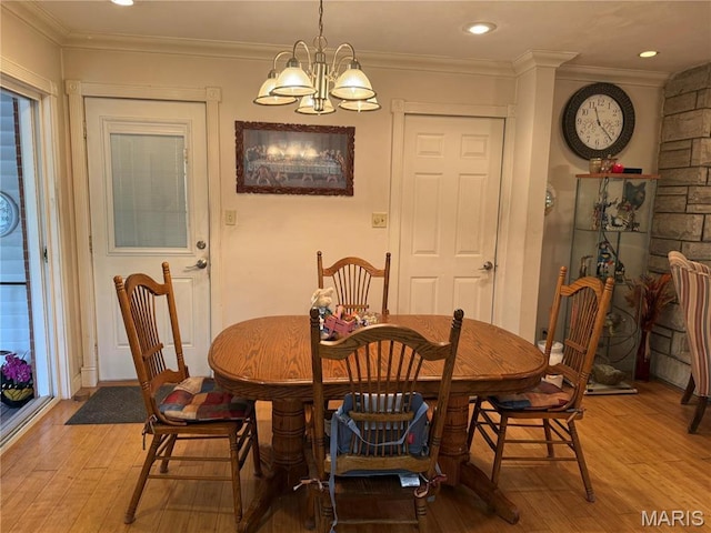 455 Country Club Dr, Hannibal, MO 63401 - dining area with light wood-style flooring, a chandelier, and ornamental molding