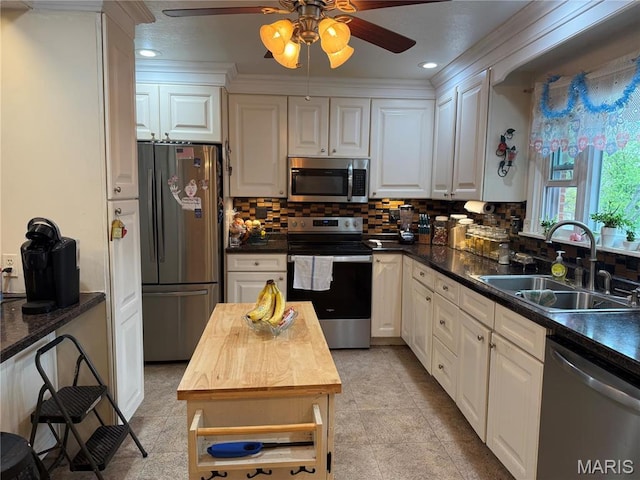 455 Country Club Dr, Hannibal, MO 63401 - kitchen featuring stainless steel appliances, a sink, ceiling fan, white cabinets, and recessed lighting