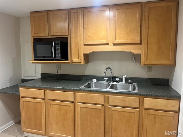 455 Country Club Dr, Hannibal, MO 63401 - kitchen with black microwave, a sink, and dark countertops