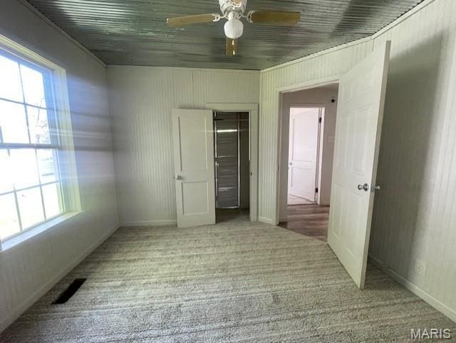 2317 Pike St, Poplar Bluff, MO 63901 - unfurnished bedroom with carpet, baseboards, a ceiling fan, and a closet
