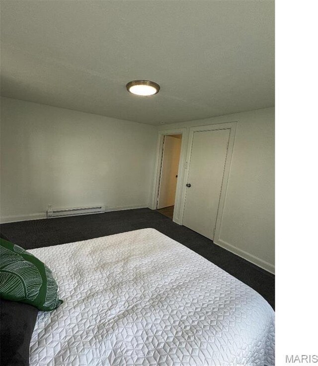 61 Pine Trl, Fairview Heights, IL 62208 - unfurnished bedroom with a baseboard heating unit