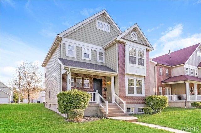 4007 Lafayette Ave, Saint Louis, MO 63110 - view of front facade featuring a front yard and covered porch