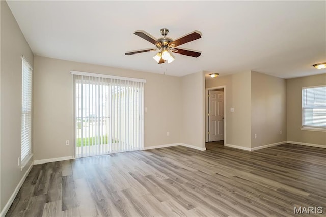 4007 Lafayette Ave, Saint Louis, MO 63110 - empty room with ceiling fan, wood finished floors, and baseboards
