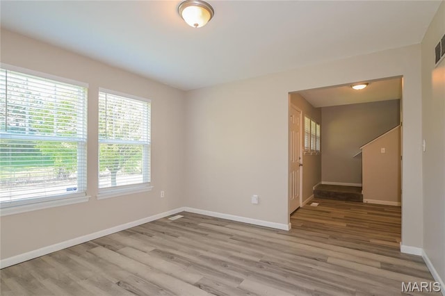 4007 Lafayette Ave, Saint Louis, MO 63110 - unfurnished room featuring wood finished floors and baseboards