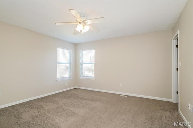4007 Lafayette Ave, Saint Louis, MO 63110 - unfurnished room with carpet floors, ceiling fan, and baseboards