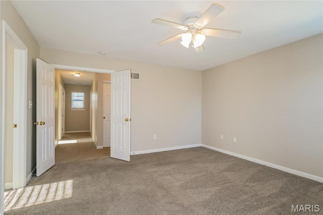 4007 Lafayette Ave, Saint Louis, MO 63110 - unfurnished bedroom featuring carpet floors, baseboards, and ceiling fan