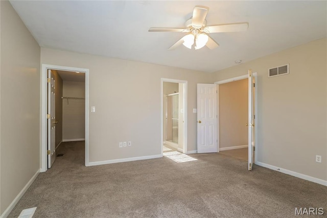 4007 Lafayette Ave, Saint Louis, MO 63110 - unfurnished bedroom with a spacious closet, carpet, and baseboards