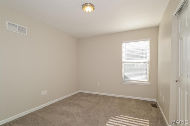 4007 Lafayette Ave, Saint Louis, MO 63110 - unfurnished room featuring healthy amount of natural light, carpet flooring, and baseboards