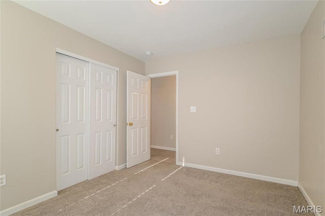 4007 Lafayette Ave, Saint Louis, MO 63110 - unfurnished bedroom with carpet floors, baseboards, and a closet