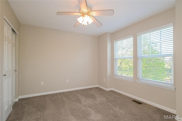 4007 Lafayette Ave, Saint Louis, MO 63110 - carpeted spare room featuring baseboards and a ceiling fan