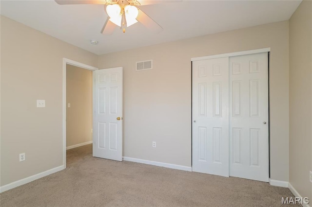 4007 Lafayette Ave, Saint Louis, MO 63110 - unfurnished bedroom featuring carpet, a closet, baseboards, and a ceiling fan