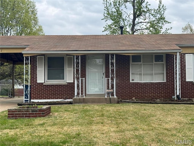 1731 Atmore Dr, Saint Louis, MO 63136 - ranch-style home featuring brick siding, a front lawn, and a shingled roof