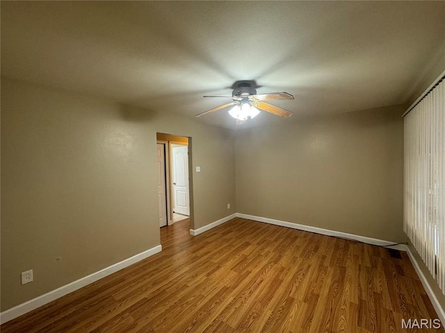 1731 Atmore Dr, Saint Louis, MO 63136 - unfurnished room featuring ceiling fan, wood finished floors, and baseboards