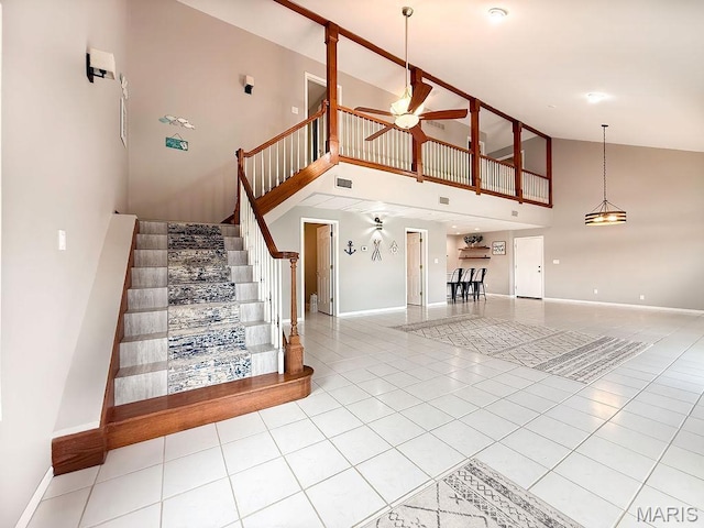 632 N Lafitte Dr, Bonne Terre, MO 63628 - stairs featuring high vaulted ceiling, baseboards, tile patterned floors, and ceiling fan