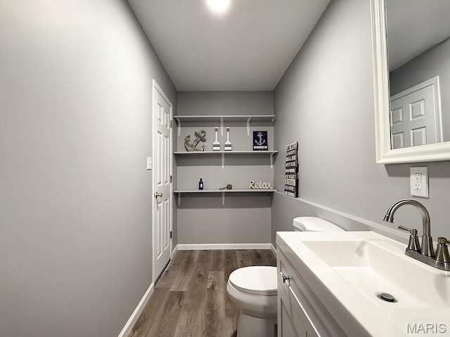 632 N Lafitte Dr, Bonne Terre, MO 63628 - bathroom featuring wood finished floors, toilet, and vanity