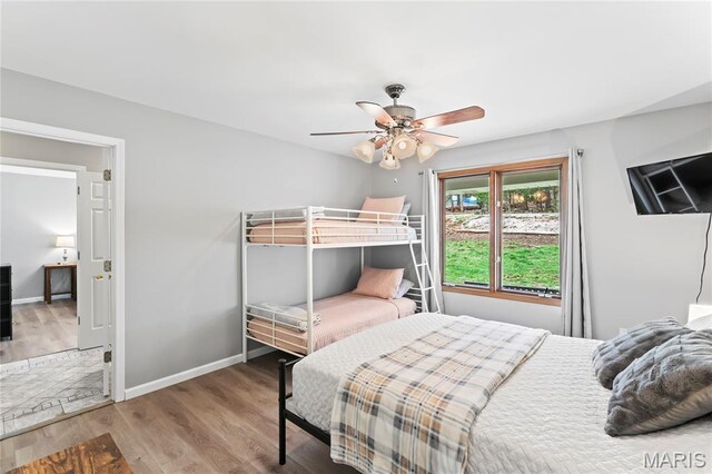 632 N Lafitte Dr, Bonne Terre, MO 63628 - bedroom with wood finished floors, ceiling fan, and baseboards