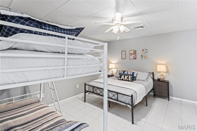 632 N Lafitte Dr, Bonne Terre, MO 63628 - tiled bedroom featuring baseboards, a ceiling fan, and a drop ceiling