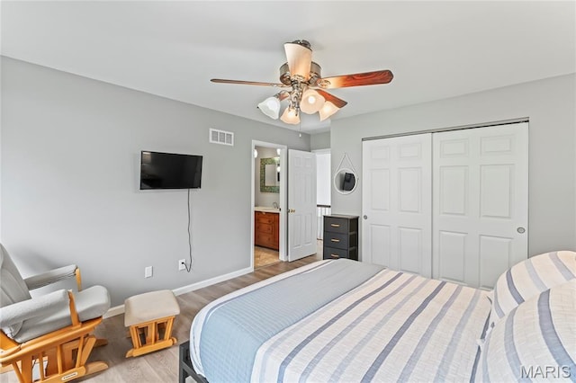632 N Lafitte Dr, Bonne Terre, MO 63628 - bedroom with light wood-type flooring, baseboards, a closet, a ceiling fan, and connected bathroom