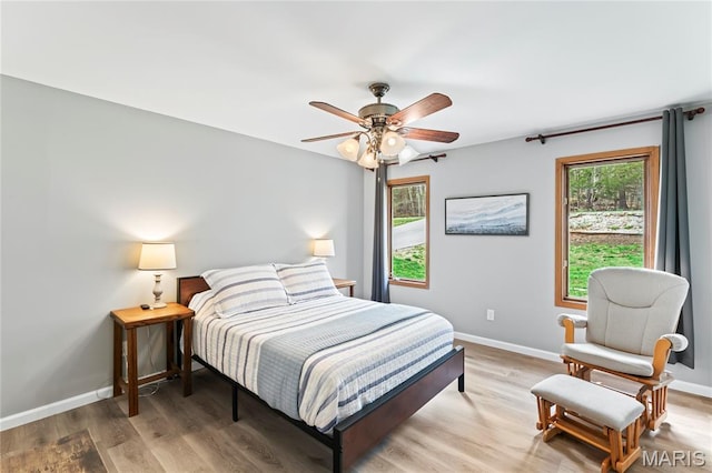 632 N Lafitte Dr, Bonne Terre, MO 63628 - bedroom featuring baseboards, light wood-style floors, and a ceiling fan
