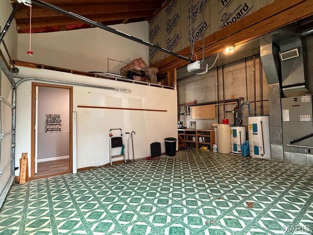 632 N Lafitte Dr, Bonne Terre, MO 63628 - garage with a garage door opener, water heater, and heating unit