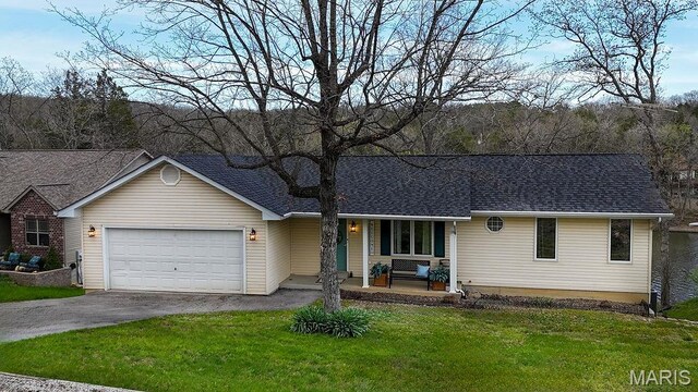 632 N Lafitte Dr, Bonne Terre, MO 63628 - single story home with a porch, driveway, a garage, a front yard, and a shingled roof