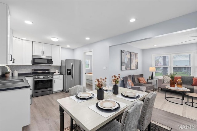 449 Hillcrest Blvd, Ballwin, MO 63021 - dining space with light wood finished floors, plenty of natural light, and recessed lighting
