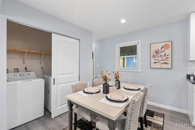 449 Hillcrest Blvd, Ballwin, MO 63021 - dining area with washer / clothes dryer, light wood-style floors, baseboards, and recessed lighting