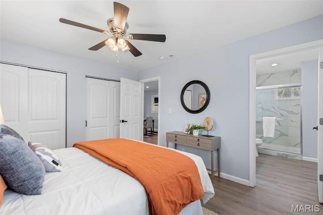449 Hillcrest Blvd, Ballwin, MO 63021 - bedroom featuring two closets, wood finished floors, baseboards, ensuite bath, and recessed lighting