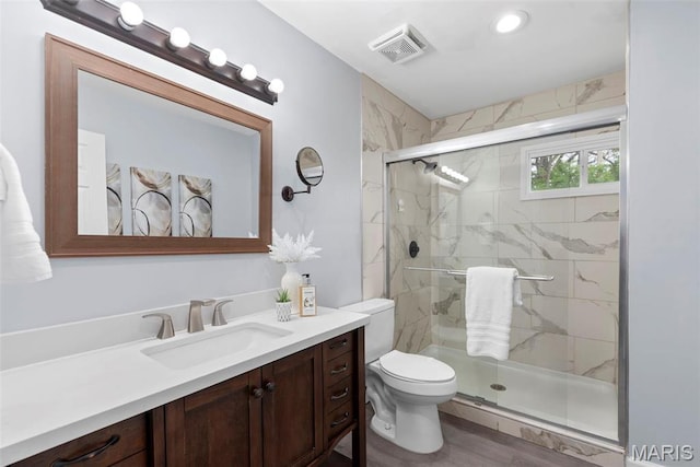 449 Hillcrest Blvd, Ballwin, MO 63021 - full bathroom featuring a stall shower, vanity, and toilet