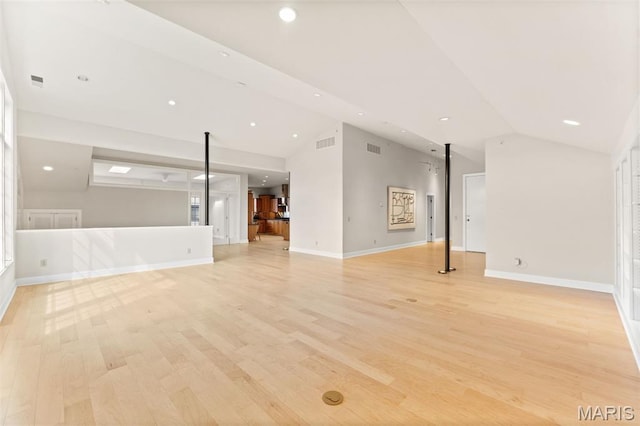 6 Brighton Way Unit 4D, Clayton, MO 63105 - unfurnished living room with vaulted ceiling, light wood finished floors, and recessed lighting