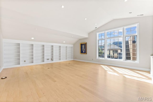 6 Brighton Way Unit 4D, Clayton, MO 63105 - unfurnished living room featuring lofted ceiling, light wood-style flooring, built in features, and recessed lighting