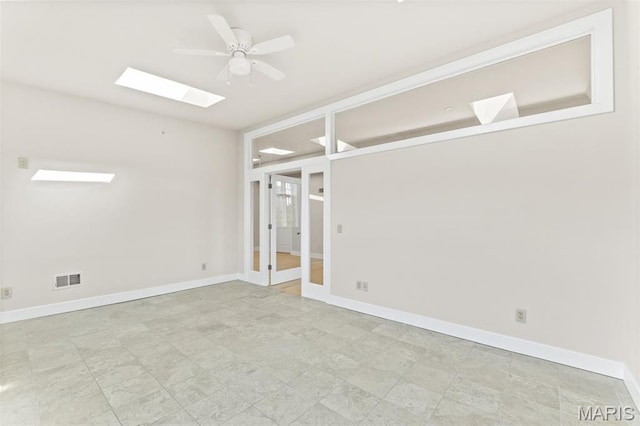 6 Brighton Way Unit 4D, Clayton, MO 63105 - spare room with a skylight, a ceiling fan, and french doors