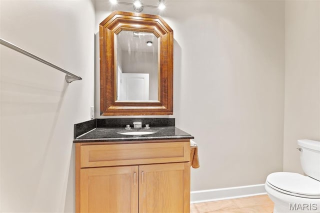 6 Brighton Way Unit 4D, Clayton, MO 63105 - bathroom featuring toilet and vanity