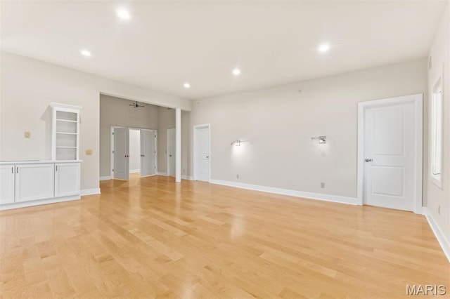 6 Brighton Way Unit 4D, Clayton, MO 63105 - empty room featuring light wood-style floors and recessed lighting