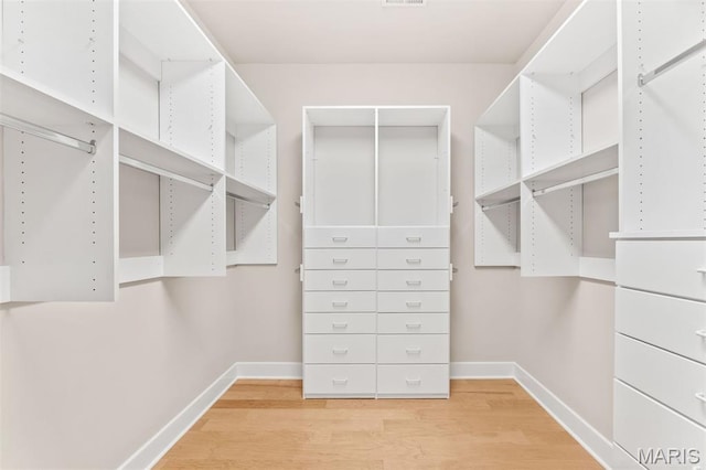 6 Brighton Way Unit 4D, Clayton, MO 63105 - walk in closet with wood finished floors