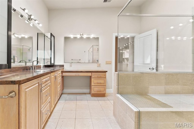 6 Brighton Way Unit 4D, Clayton, MO 63105 - bathroom with vanity, tile patterned floors, tiled bath, and a shower