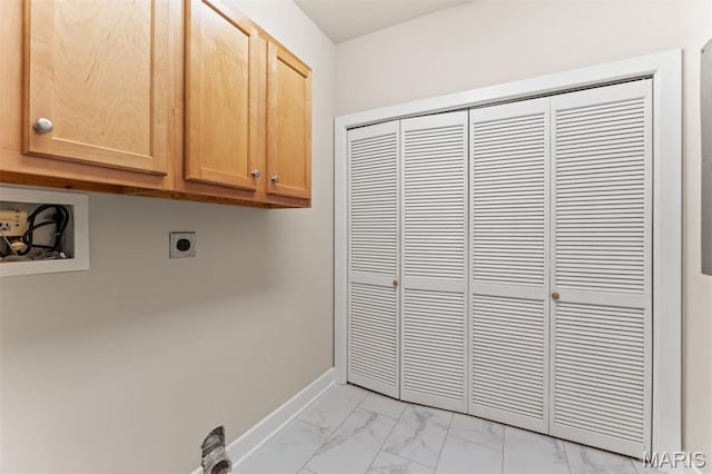 6 Brighton Way Unit 4D, Clayton, MO 63105 - washroom with hookup for an electric dryer, cabinet space, light marble finish floors, and hookup for a washing machine
