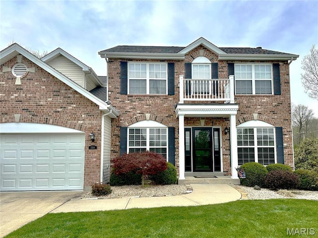 1509 Cedar Ridge Dr, Ofallon, IL 62269 - colonial home featuring brick siding, concrete driveway, and a garage