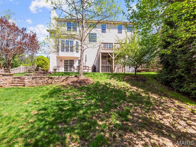1509 Cedar Ridge Dr, Ofallon, IL 62269 - rear view of house featuring a lawn and a chimney